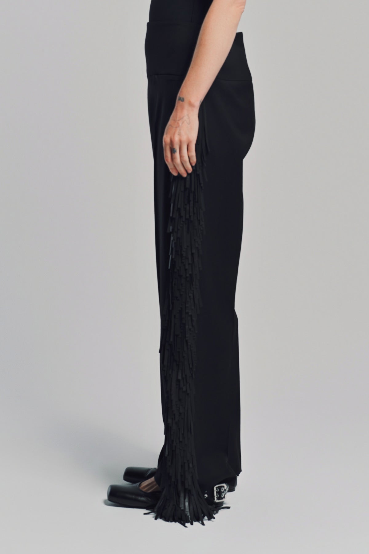ALAÏA | FRINGED WOOL GABARDINE PANTS