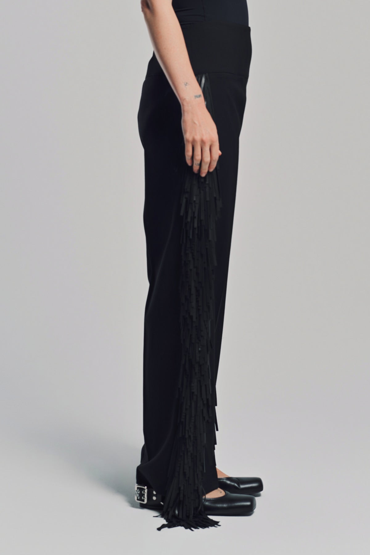 ALAÏA | FRINGED WOOL GABARDINE PANTS