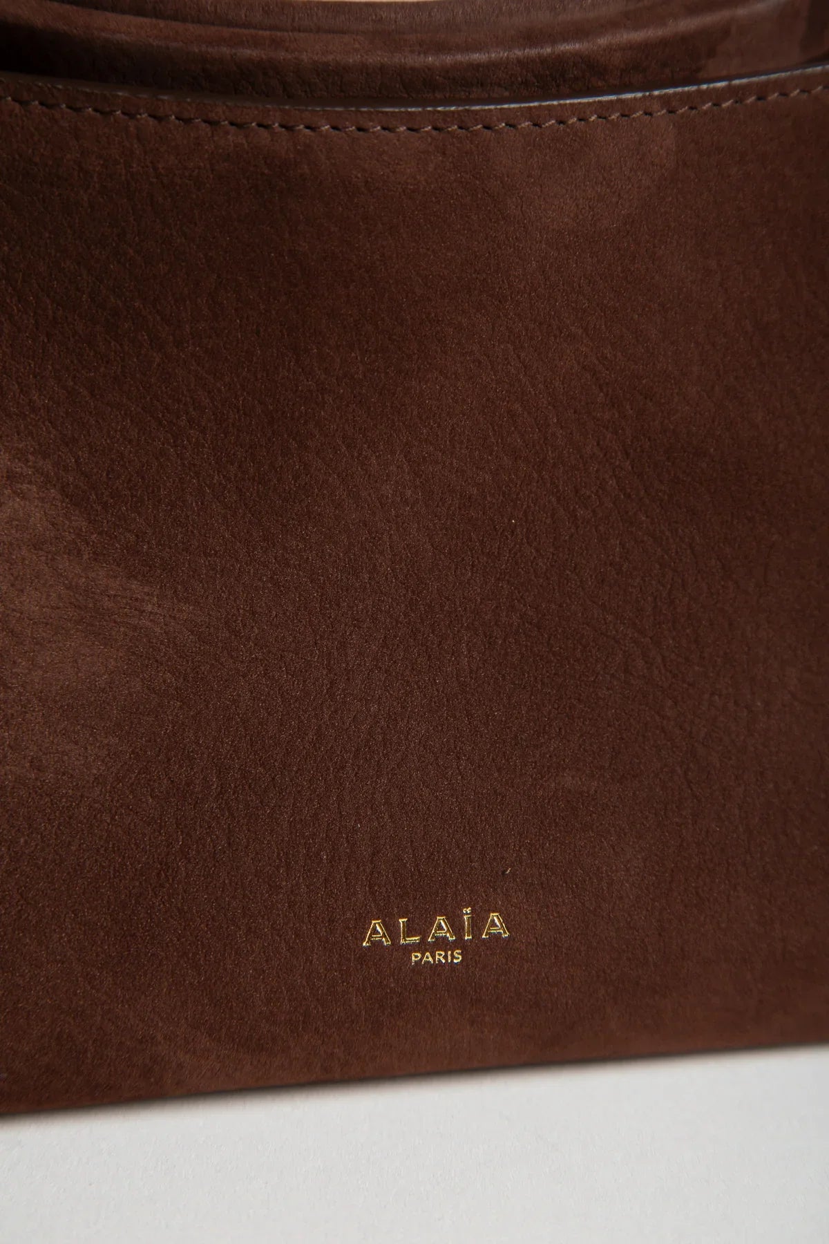 ALAÏA | LE CLICK SMALL SQUARE BAG IN NUBUCK