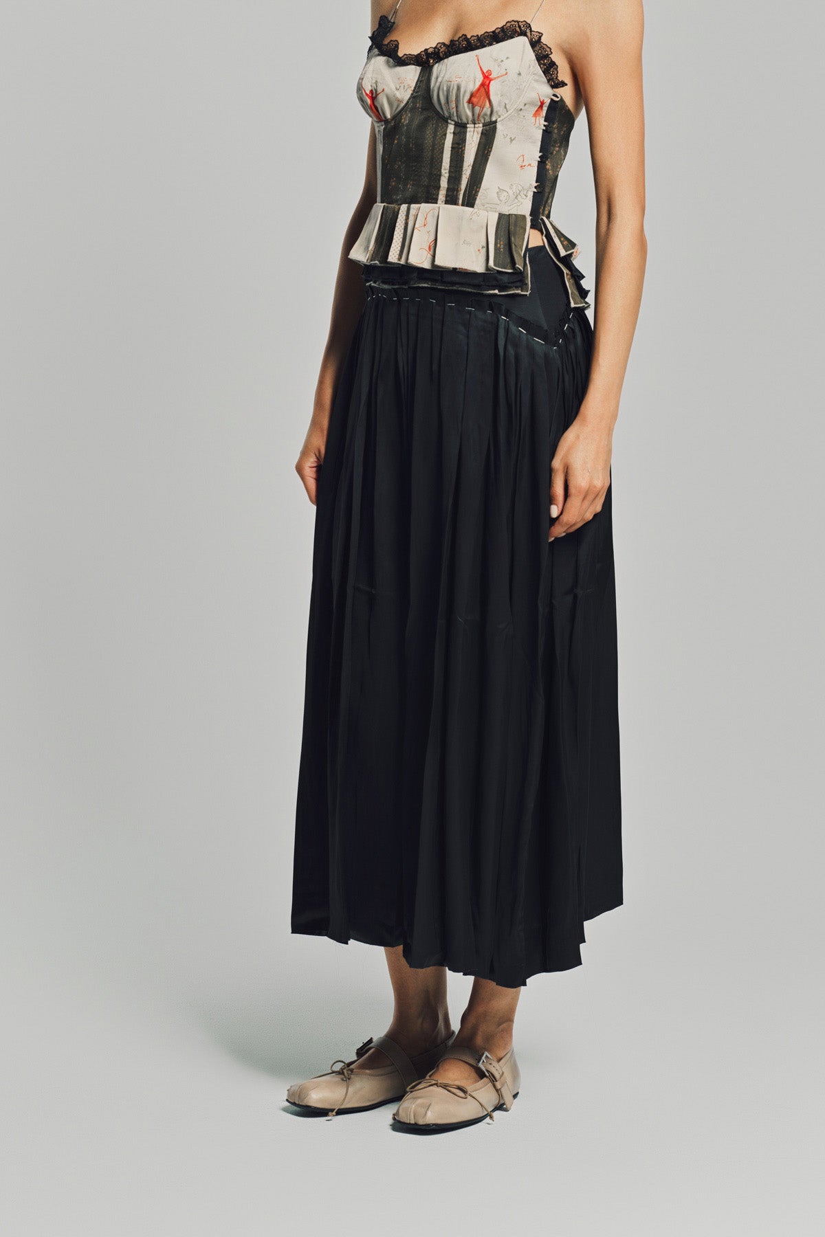 MERUERT TOLEGEN | LIQUID BASTED PLEATED SKIRT