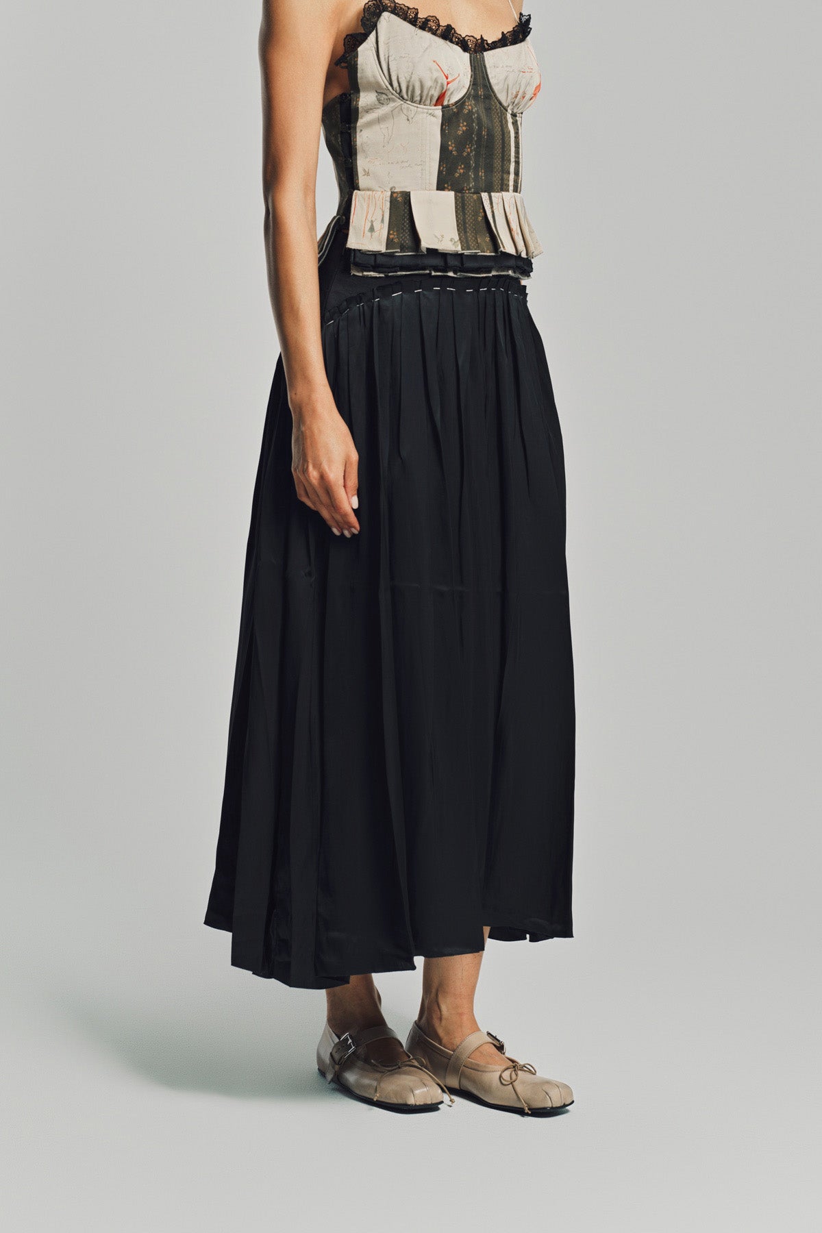 MERUERT TOLEGEN | LIQUID BASTED PLEATED SKIRT
