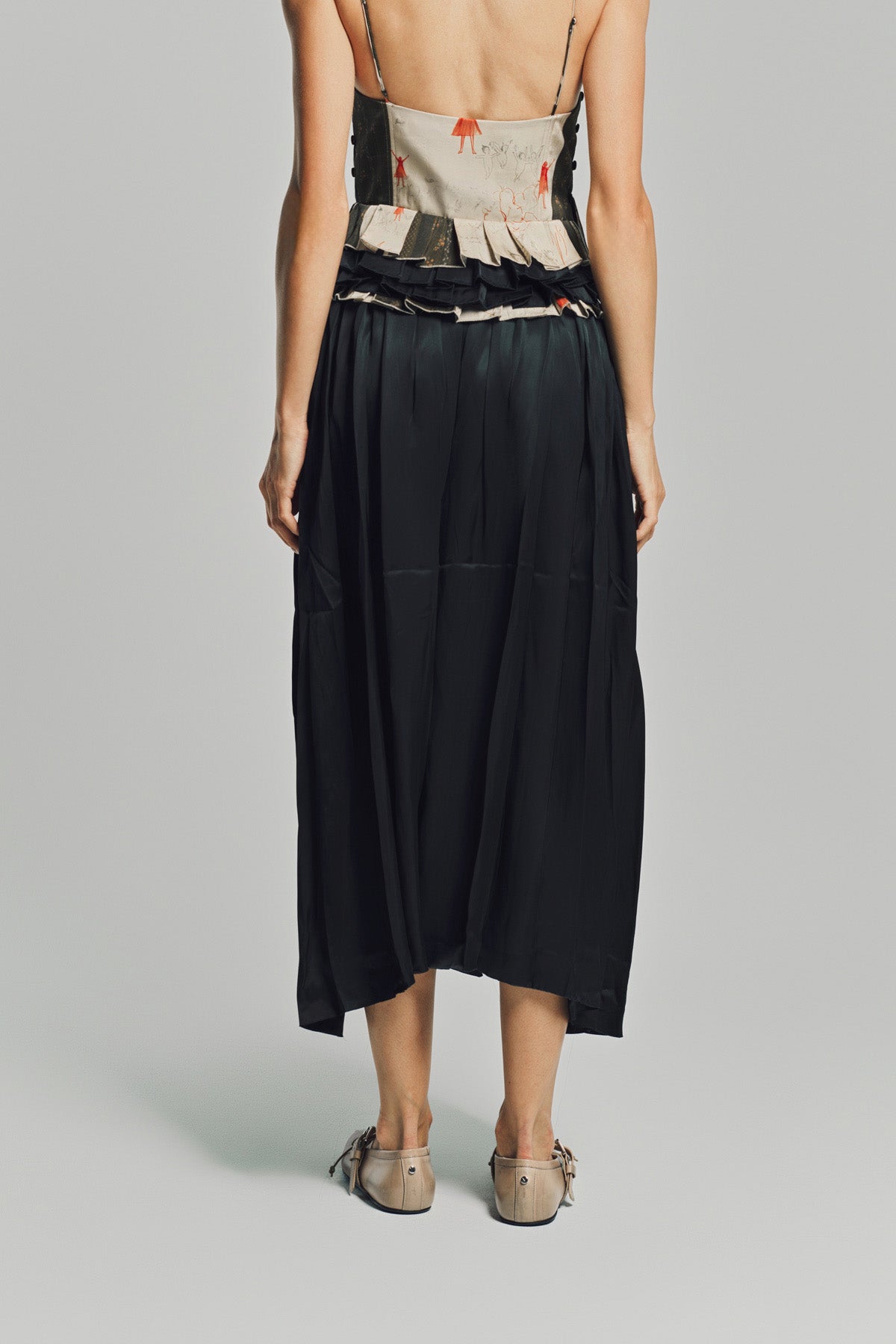 MERUERT TOLEGEN | LIQUID BASTED PLEATED SKIRT