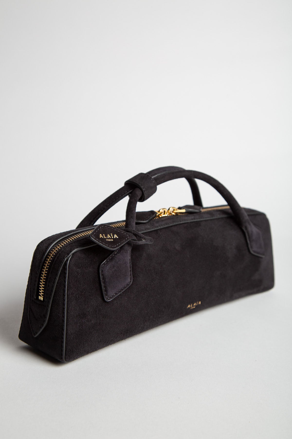 ALAIA | LE TECKEL CLUTCH IN SUEDE GOATSKIN