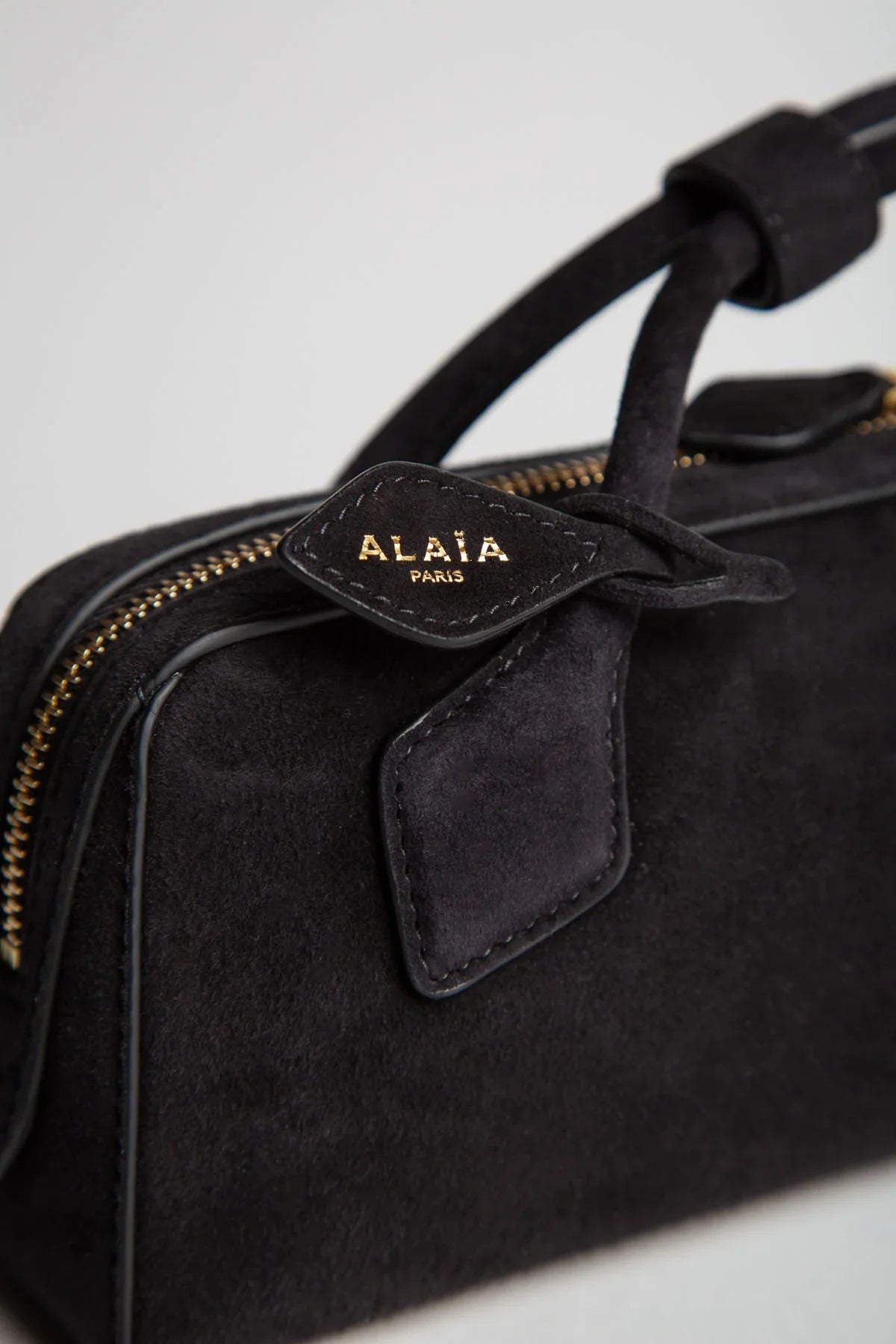 ALAIA | LE TECKEL CLUTCH IN SUEDE GOATSKIN