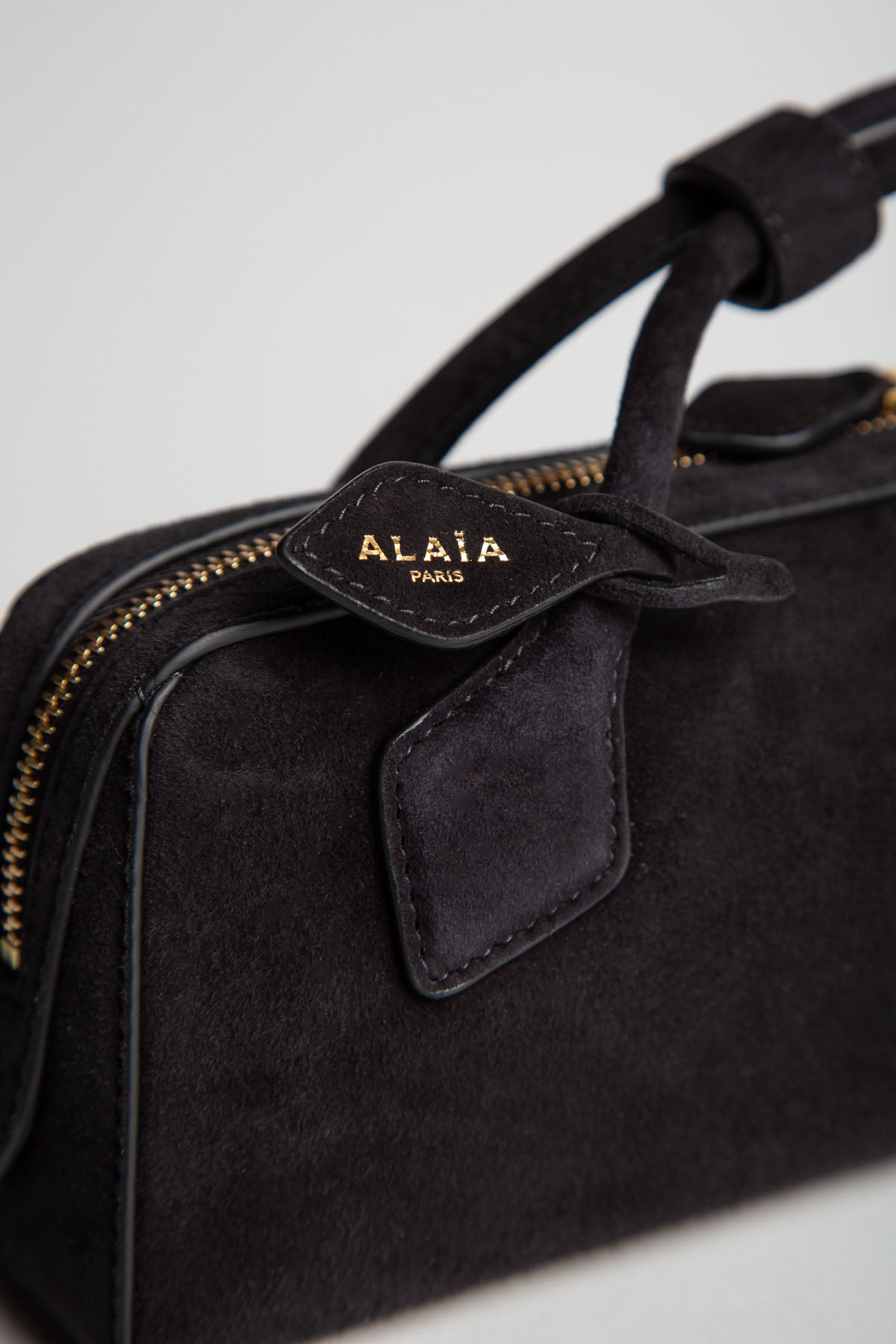 ALAIA | LE TECKEL CLUTCH IN SUEDE GOATSKIN