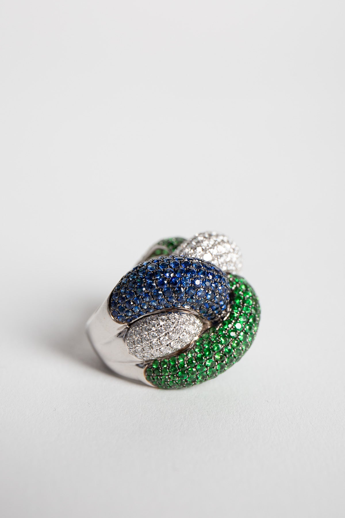 STEFERE | WHITE GOLD, DIAMOND, GREEN GARNET, BLUE SAPPHIRE KNOT RING