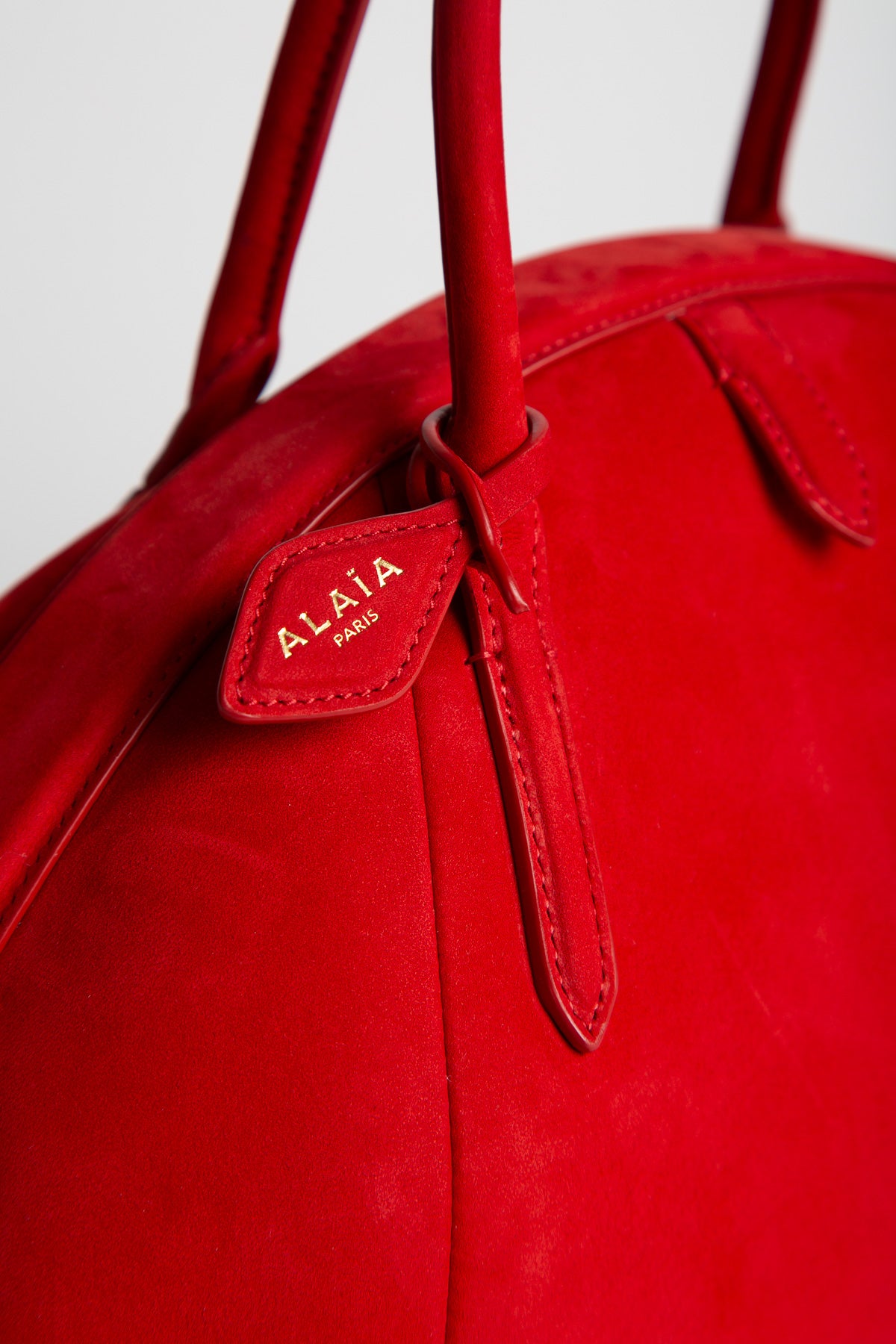 Alaïa | Purse Top Handle Bag in Nubuck