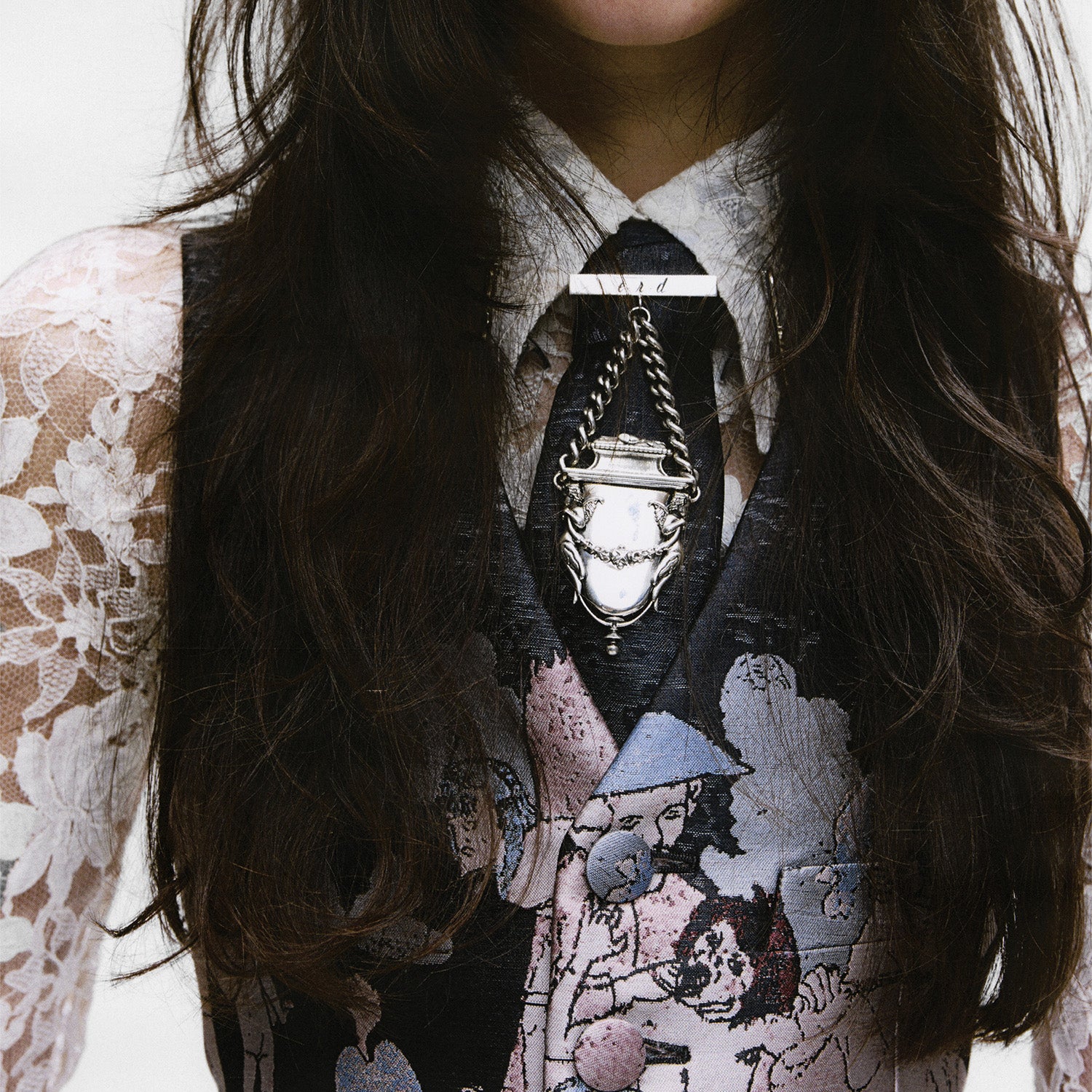 Person wearing a enfants riches deprimes lacr blouse and a necklace.