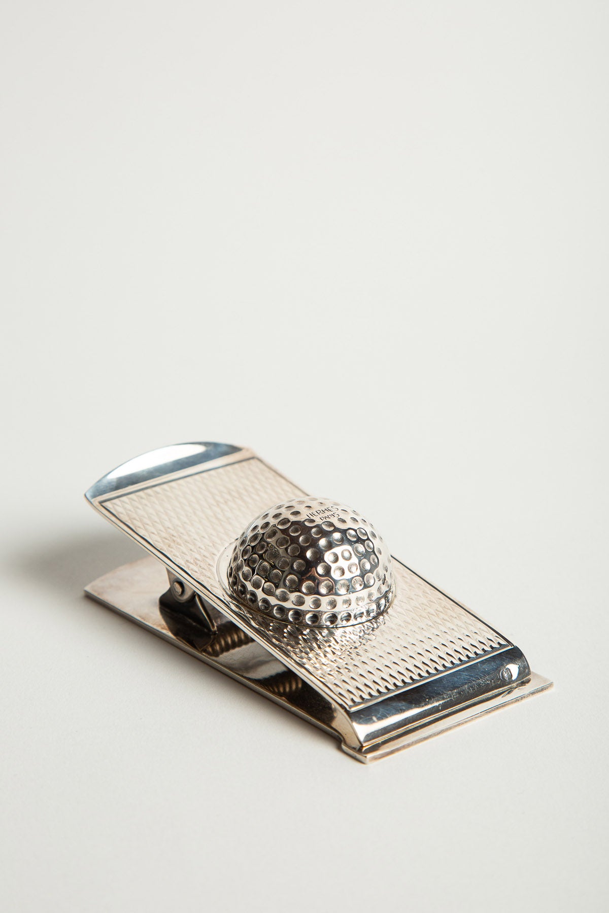 HERMÈS | 1960'S SILVER GOLF BALL PAPER CLIP