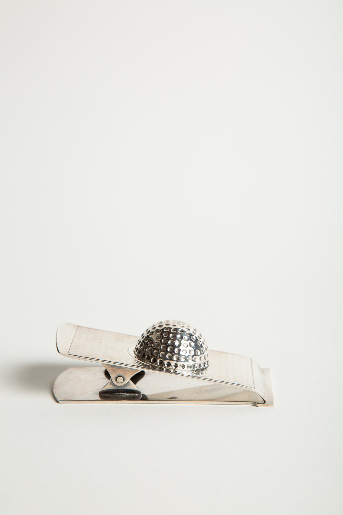 HERMÈS | 1960'S SILVER GOLF BALL PAPER CLIP