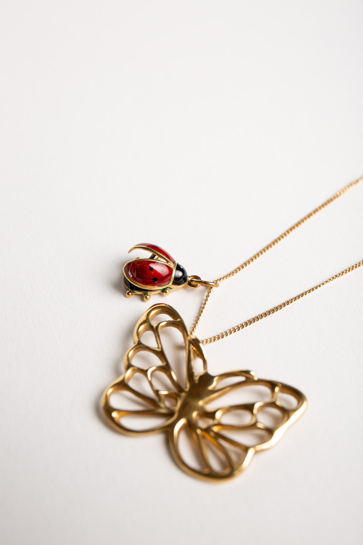 ANGELA CUMMINGS FOR TIFFANY & CO. | VINTAGE GOLD BUTTERFLY PENDANT WITH LADYBUG CHARM & CHAIN