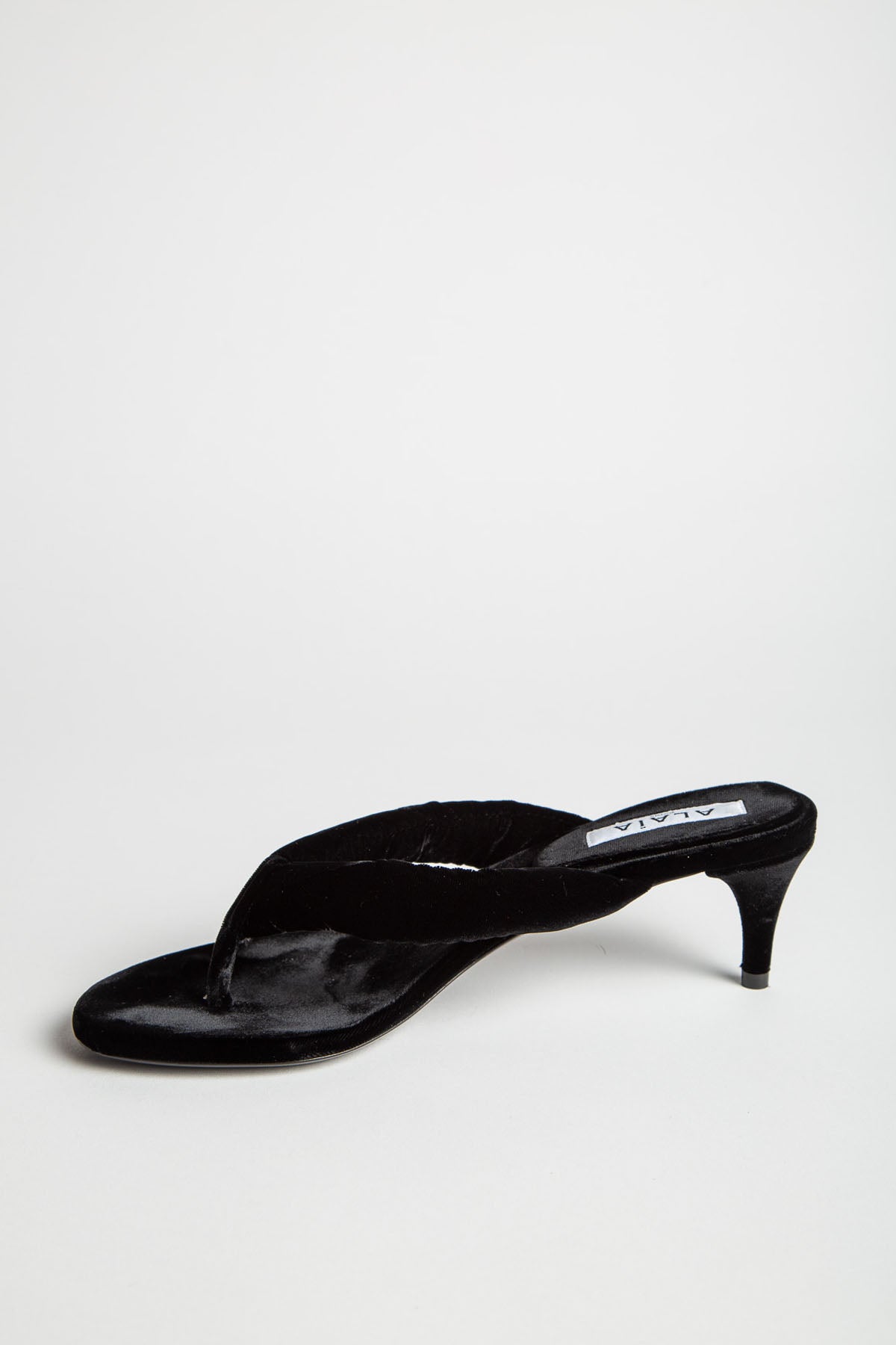 ALAÏA | HEEL THONG MULES IN VELVET