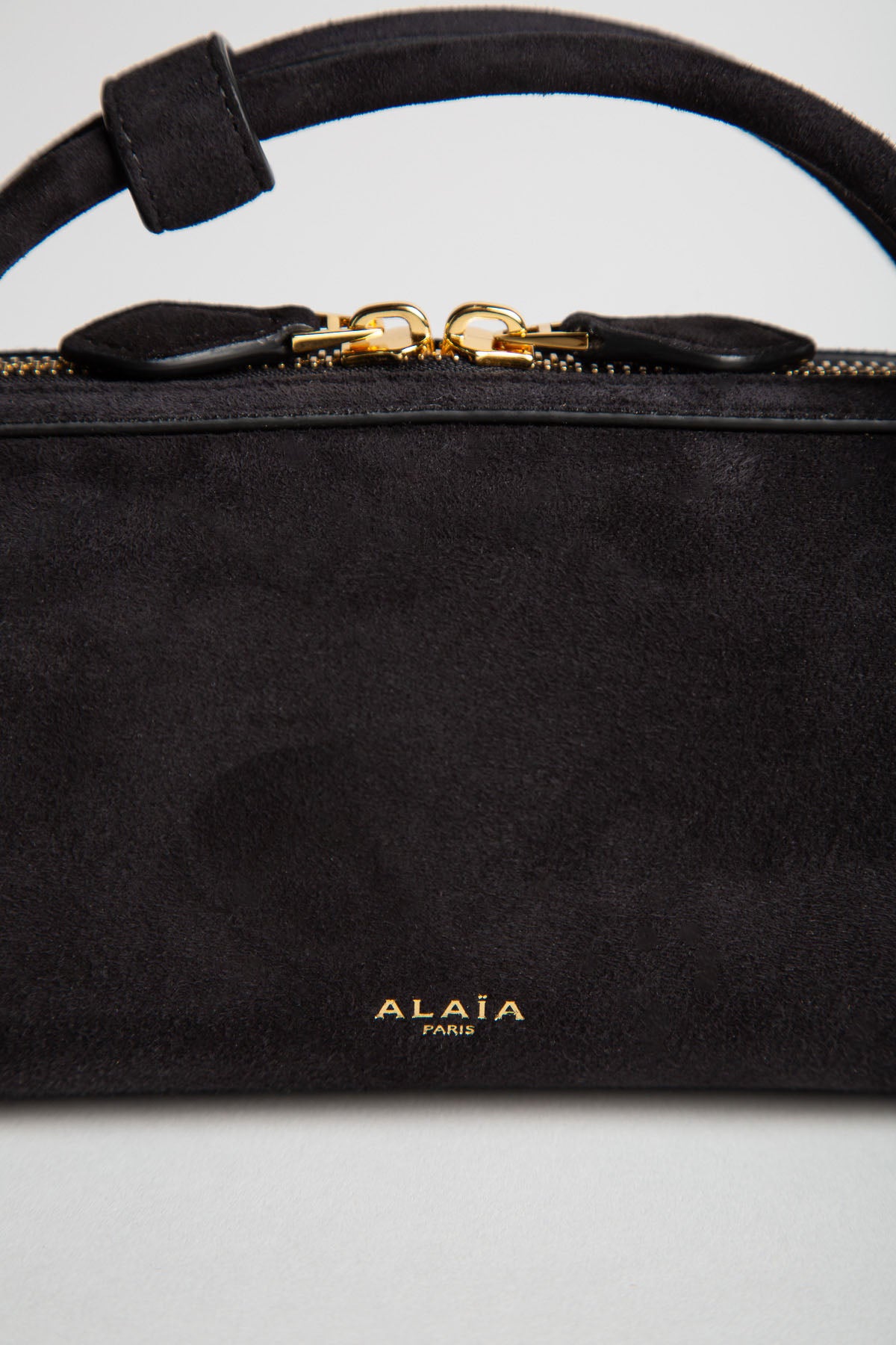 ALAIA | LE TECKEL CLUTCH IN SUEDE GOATSKIN