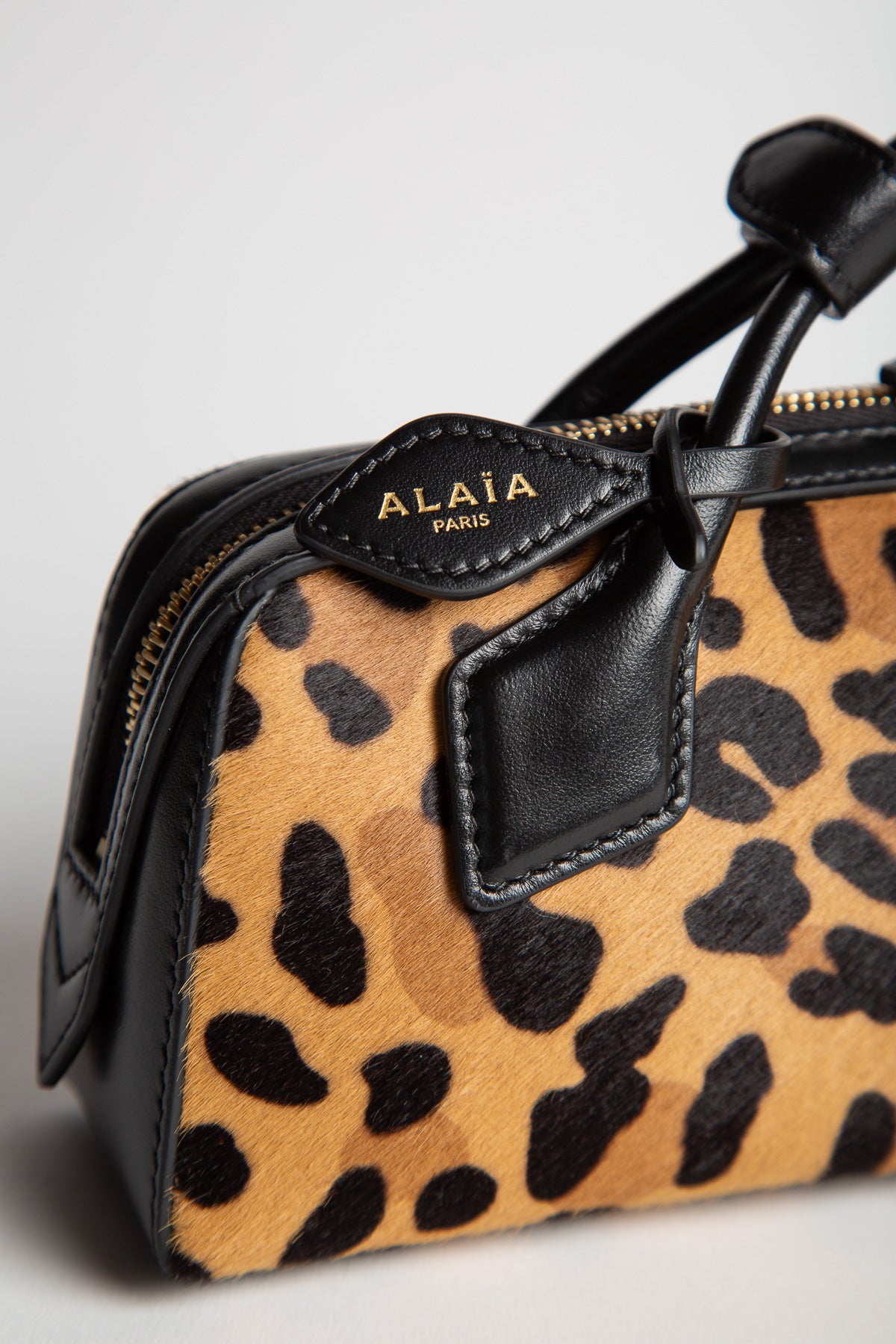 ALAIA | LE TECKEL CLUTCH IN LEOPARD HAIRCALF