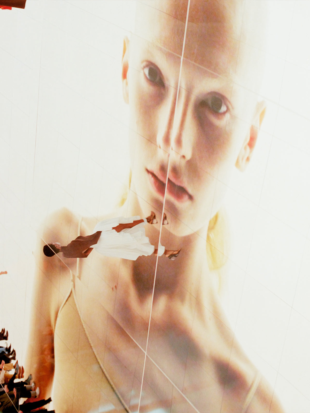 Close-up of a person with a blurred background the Alaïa fashion show.