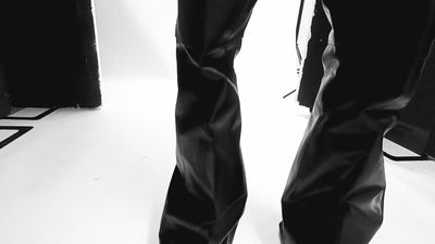 Video of a person wearing black leather Rick Owens
