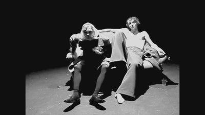 Video of two men dressed in dries van noten with drinks
