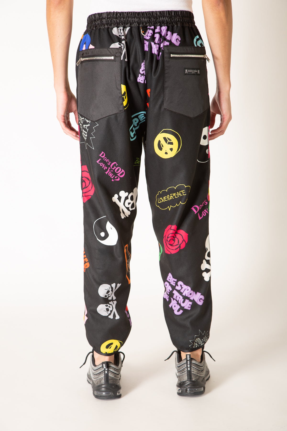 MASTERMIND | ALL OVER MOTIF TRACK PANTS